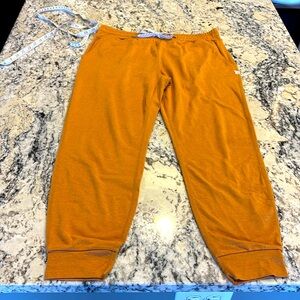 Women’s Vuori joggers size Small. Mustard color.
